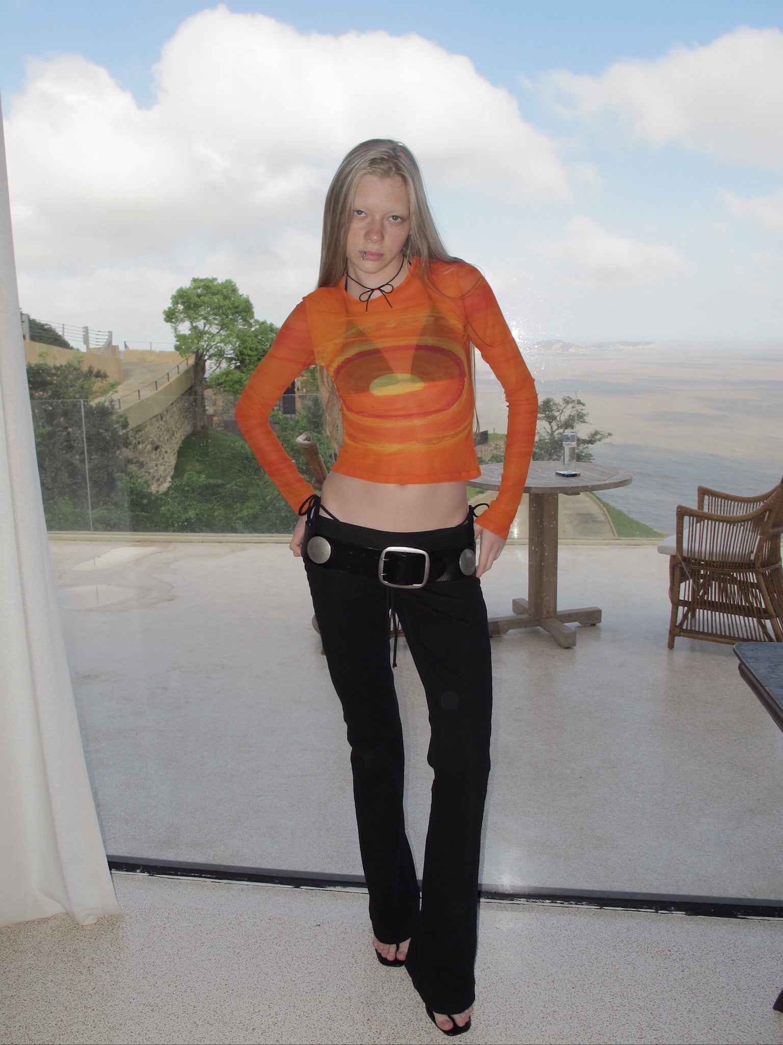 An orange galaxy top.