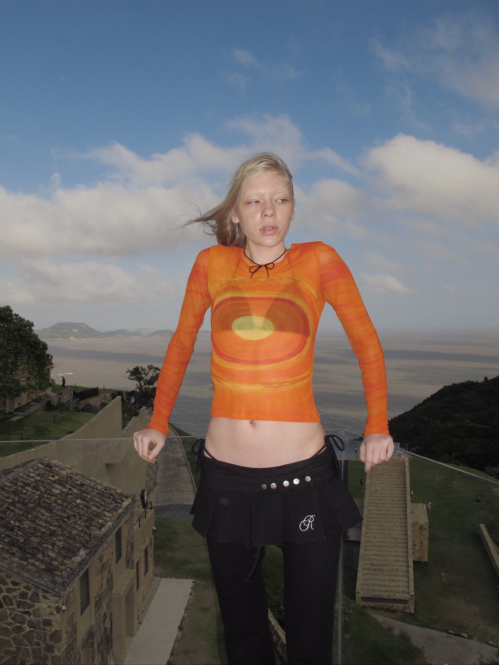 An orange galaxy top.